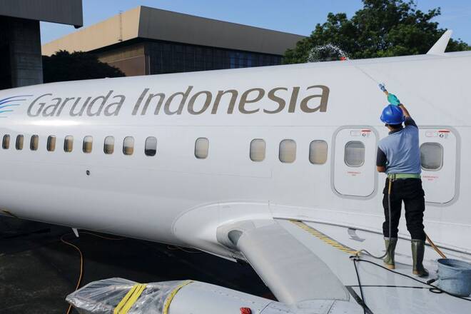 A worker cleans an aircraft at GMF AeroAsia, near Jakarta