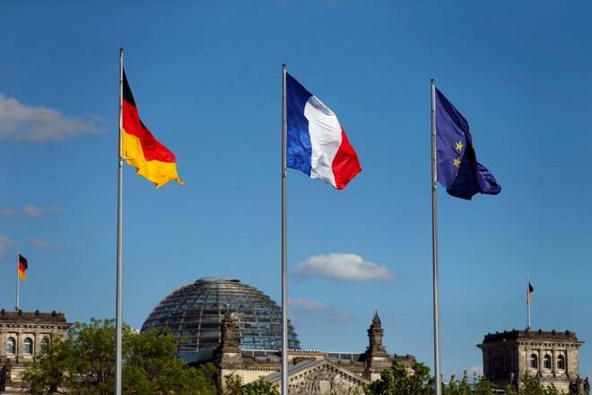 The flags of Germany, France and the European Union are seen in front of the the Chancellery, before the meeting between German Chancellor Angela Merkel and French President Emmanuel Macron in Berlin