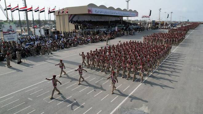 Members of Houthi military forces parade in the Red Sea port city of Hodeida