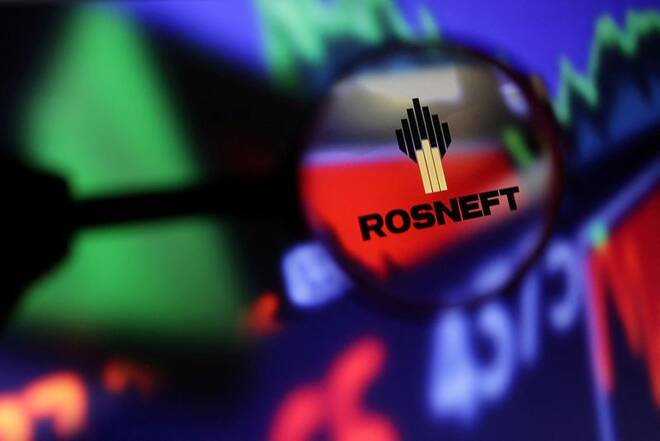 Illustration shows Rosneft logo and stock graph