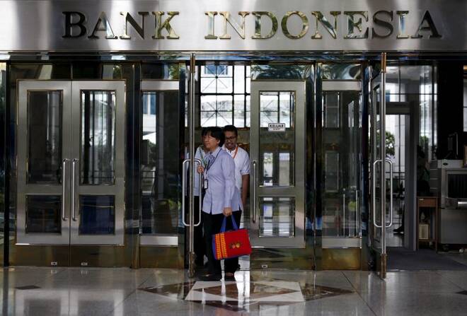 People walk out of a building inside the Bank Indonesia complex in Jakarta, Indonesia