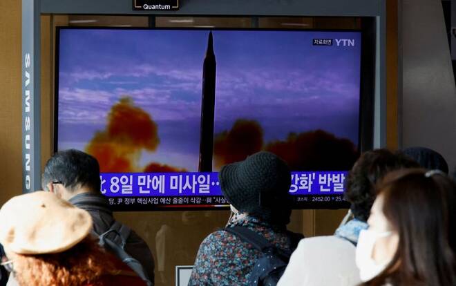 People watch a TV broadcasting a news report, on North Korea firing a ballistic missile off its east coast, in Seoul