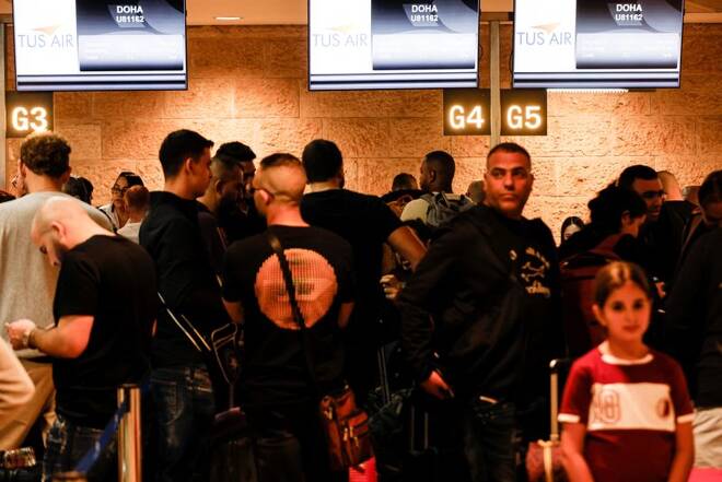Football fans queue before boarding the first direct commercial flight between Israel and Qatar for the upcoming 2022 FIFA World Cup Qatar, at Ben Gurion International Airport, near Tel Aviv