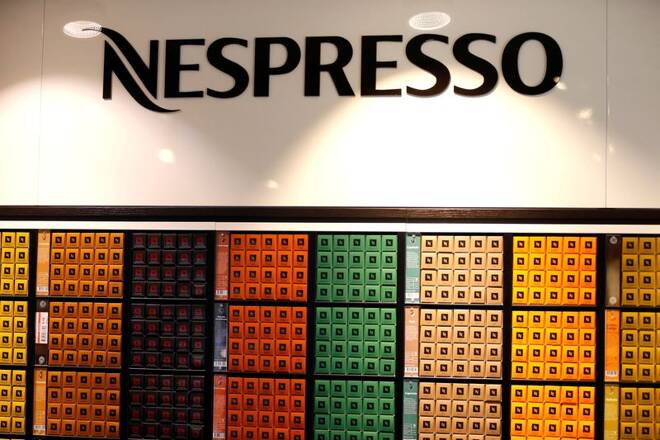 The Nespresso logo and boxes of Nespresso coffee pods are pictured in the supermarket of Nestle headquarters in Vevey