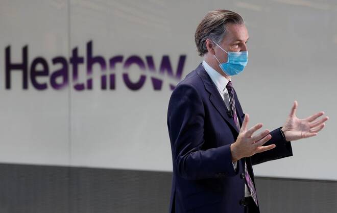 John Holland-Kaye, CEO of Heathrow Airport talks during an interview with journalists at the International arrivals area of Terminal 5 in London's Heathrow Airport