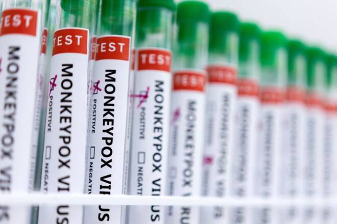 Illustration shows test tubes labelled "Monkeypox virus positive and negative