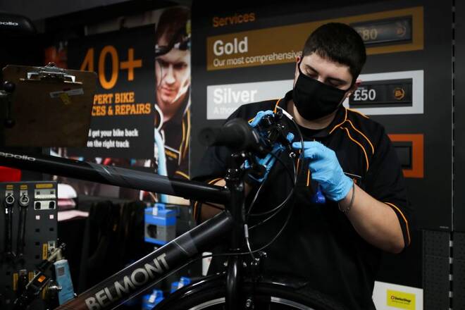 A member of staff works on a bike at Halfords in Rugby