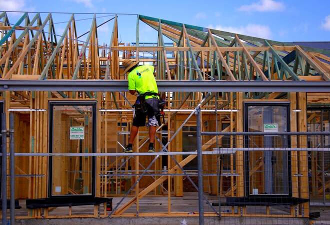 A tradesman works on the roof of a house under construction at a housing development located in the western Sydney suburb of Oran Park