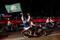 A pillion waves a Pan-Malaysian Islamic Party (PAS) flag on the eve of Malaysia's general election at Permatang Pauh