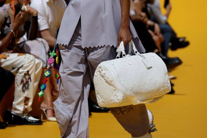 A model presents a Louis Vuitton bag as part of the Spring/Summer 2023 collection