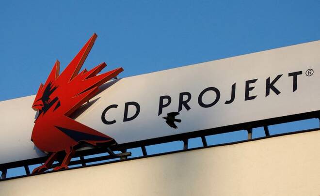 A bird flies in front of the Cd Projekt logo at its headquarters in Warsaw