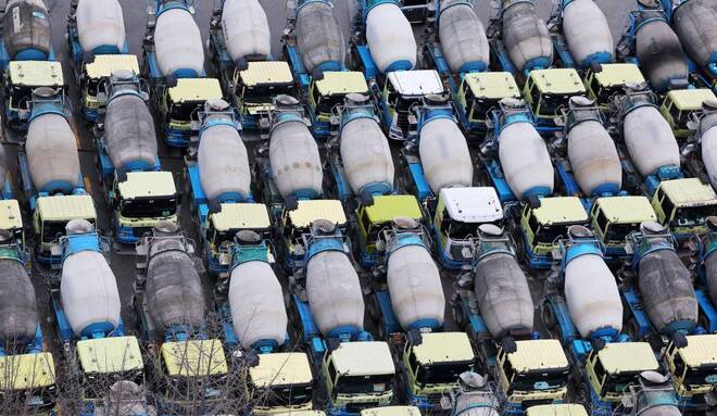 Concrete mixer trucks are parked at a factory due to a strike by a truckers' union in Anyang