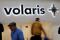 Passengers walk past the logo of Mexican low-cost air carrier Volaris at Benito Juarez International Airport in Mexico City
