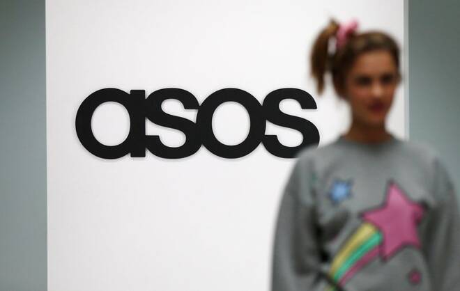 A model walks on an in-house catwalk at the ASOS headquarters in London
