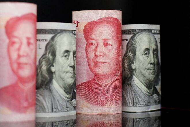 Illustration picture of Chinese yuan and U.S. dollar banknotes
