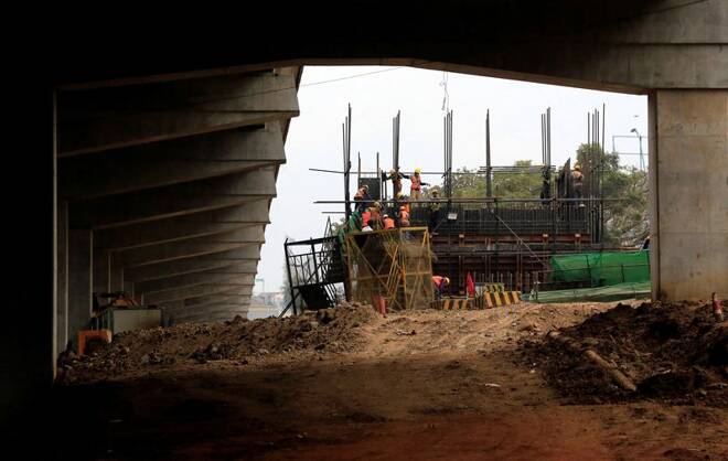 Workers work on site during the construction of the Nairobi Expressway in Nairobi