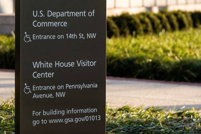 A sign in front of Department of Commerce building is seen before an expected report of new home sales numbers in Washington