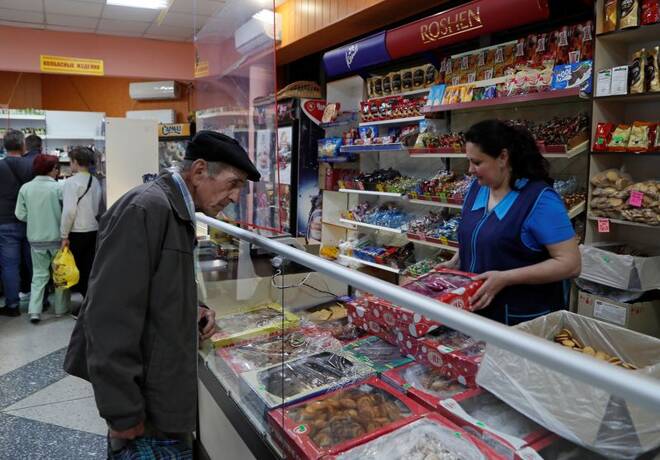 A local resident shops at a grocery store in Svitlodarsk