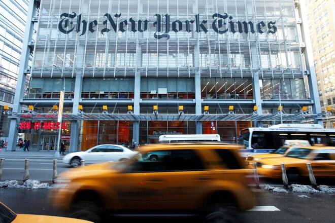 Vehicles drive past the New York Times headquarters in New York