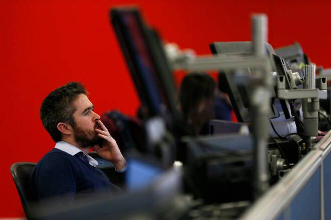 Market makers work on the trading floor at IG Index in London