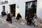 People sit outside a cafe after some curbs were lifted as coronavirus disease (COVID-19) outbreaks continue in Beijing