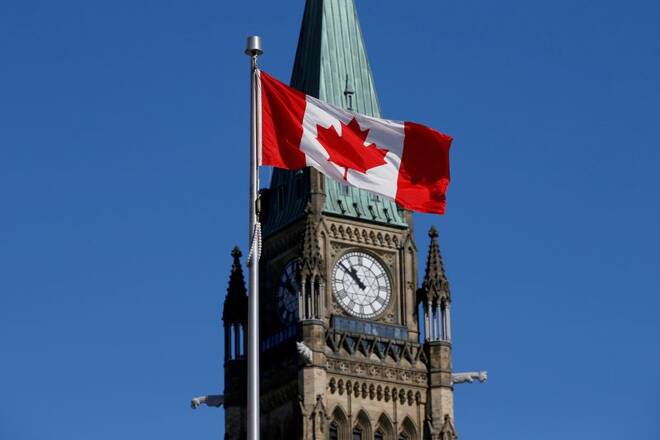Canadian flag flies in front of the Peace Tower on Parliament Hill in Ottawa