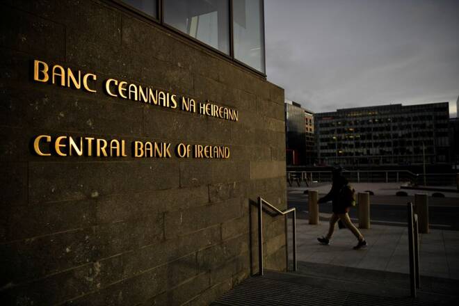 Man walks past the Central Bank of Ireland in Dublin