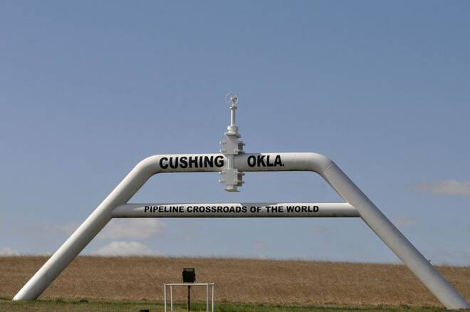 A sign built out of a pipeline that reads "pipeline crossroads of the world" welcomes visitors to town in Cushing