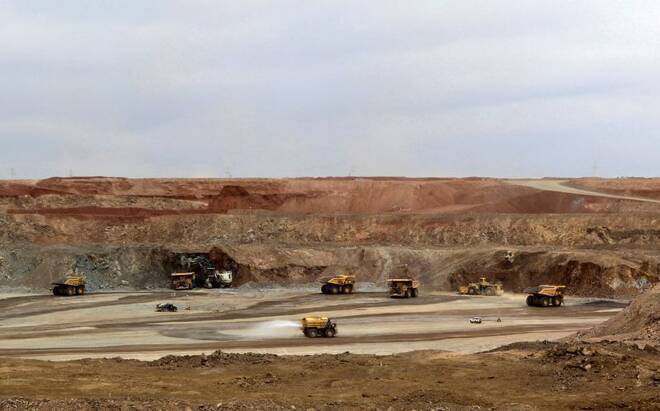 Mining trucks are seen at the Oyu Tolgoi mine in Mongolia's South Gobi region