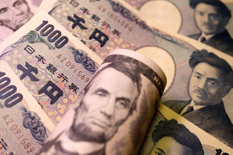 Illustration picture of Japanese yen and U.S. dollar banknotes