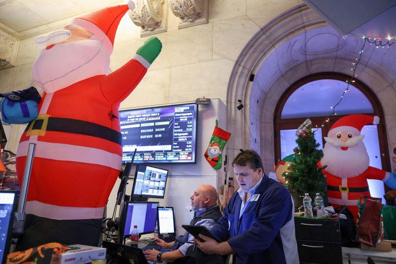 Traders work on the trading floor at the New York Stock Exchange (NYSE) in New York City