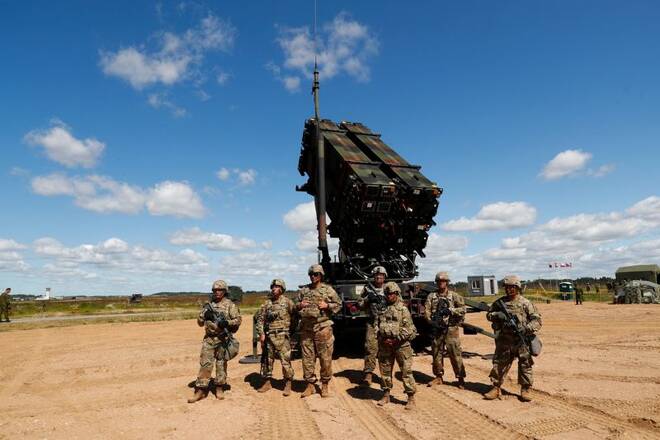 U.S. soldiers stand next to the long-range air dfence system Patriot during Toburq Legacy 2017 air defence exercise in the military airfield near Siauliai
