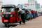Drivers push auto rickshaws in a line to buy petrol from a fuel station, amid Sri Lanka's economic crisis, in Colombo