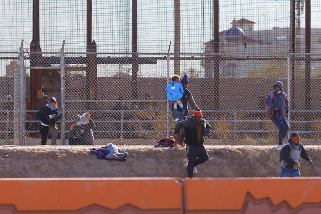 Migrants crossing into the United States from Mexico, in El Paso