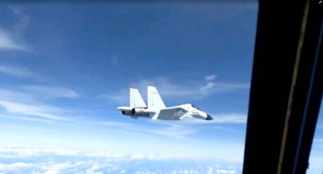 A Chinese military plane came within 20 feet (6 meters) of a U.S. Air Force aircraft