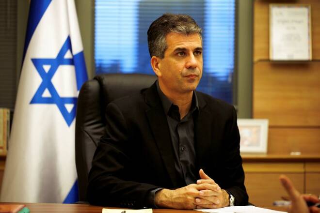 Israel's Eli Cohen, then economy minister, works at his office in the Knesset, the Israeli parliament, in Jerusalem
