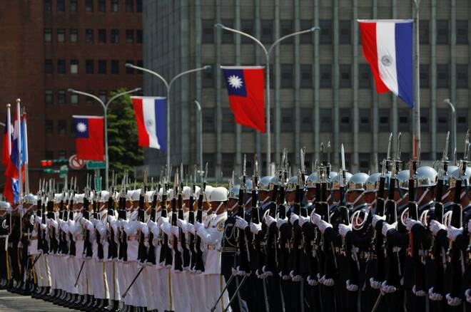 Honour guard stand guard under Paraguay and Taiwanese flags at the welcoming ceremony, in Taipei
