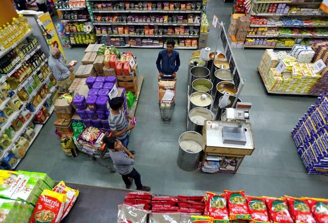 Customers buy grocery at a food superstore in Ahmedabad