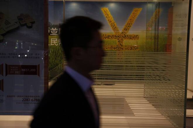 A Chinese yuan currency sign is illustrated inside a bank in Hong Kong
