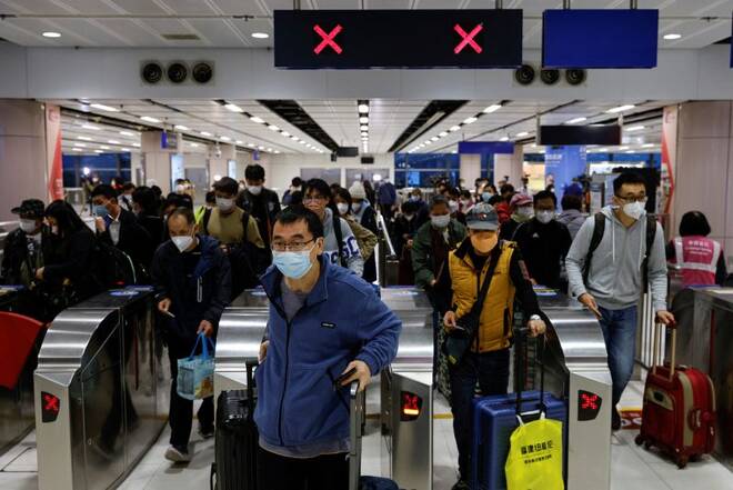 Travellers arrive at Hong Kong's Lok Ma Chau border checkpoint on the first day China reopens the border amid the COVID-19 pandemic in Hong Kong