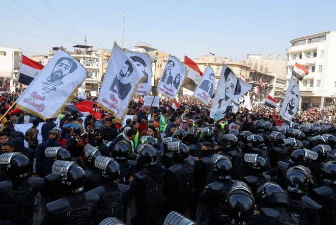 Protest against the dinar's slide in value against the U.S. dollar, near the central bank in Baghdad