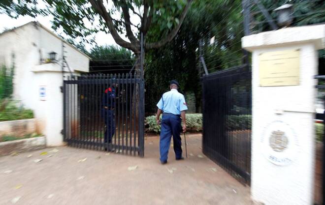 A Kenyan police officer arrives at the residence of the Venezuelan embassy's slain charge d'affaires, Fonseca, at the Runda neighbourhood in Nairobi