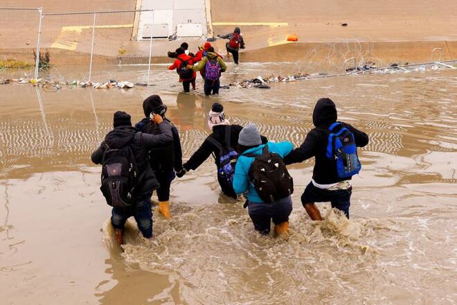 Asylum-seeking migrants cross the Rio Bravo river, as seen from Ciudad Juarez