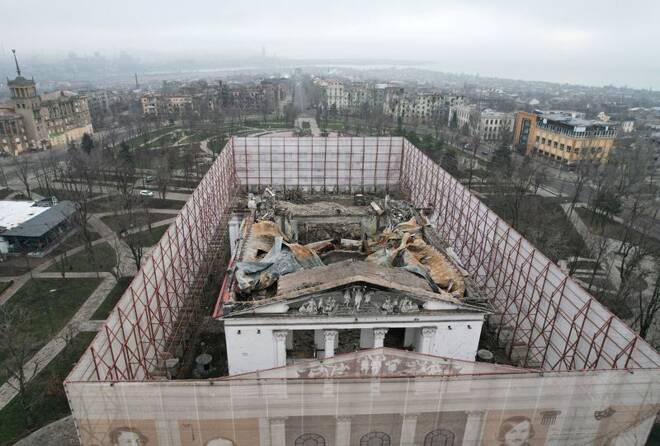 A view shows a fenced theatre building destroyed in the course of Russia-Ukraine conflict in Mariupol