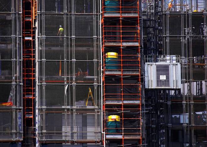 Workers can be seen on a construction site for a new apartment block building in Sydney
