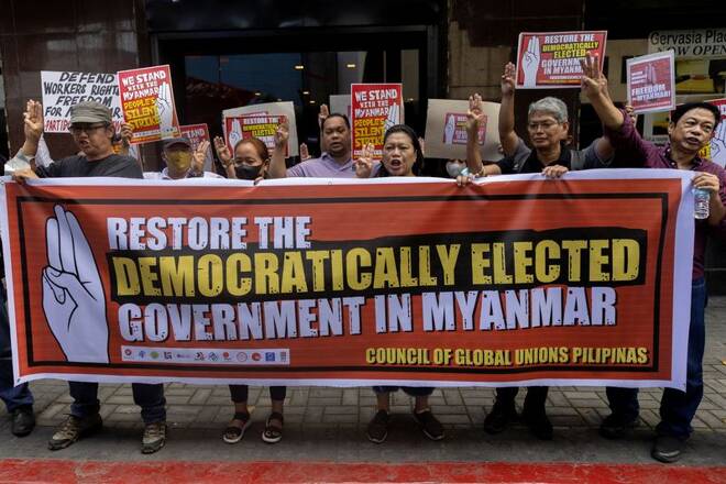 Filipino activists stage a protest in solidarity with Myanmar citizens in Makati City