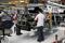 SEAT factory workers assemble a car in Martorell near Barcelona