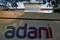 The logo of the Adani Group is seen on the wall of its realty office building on the outskirts of Ahmedabad