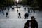 People walk in Syntagma square, in Athens