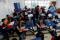High school students pedal on a bike desk for health, during classes, in San Nicolas de los Garza